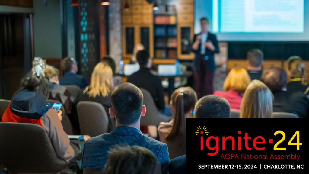 Audience listens lecturer at workshop in conference hall